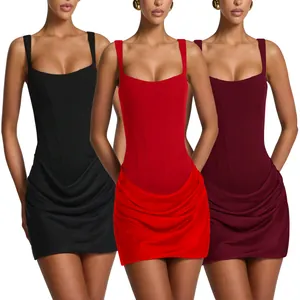 Detail view of corset mini dresses in black, red, and burgundy with draped skirt