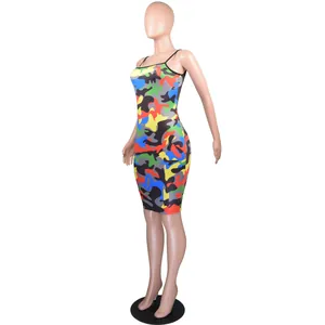 Detail view of a vibrant multi-color camouflage bodycon slip mini dress on a mannequin.