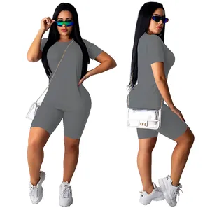 Detail showing the front and side view of grey two-piece fitness set for women