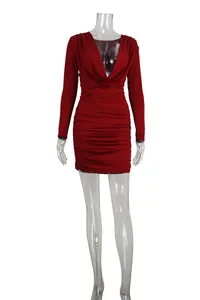 Detail showing a red cowl neck long sleeve ruched mini bodycon dress on a mannequin