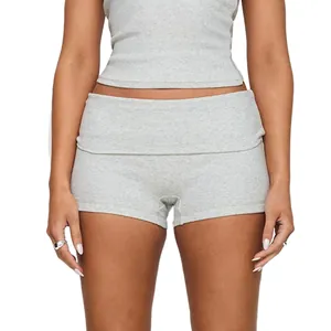 Close-up detail of grey ribbed yoga shorts featuring a stylish fold-over waistband design