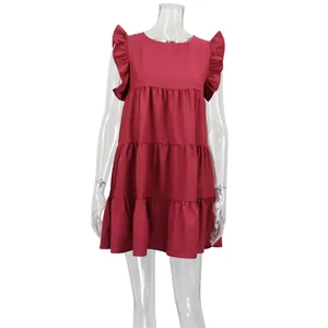 Close-up detail of burgundy ruffled tiered sleeveless summer dress for women on mannequin