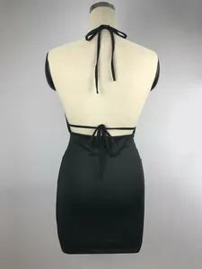 Detailed back view of a sexy black halter dress with lace-up straps on a mannequin