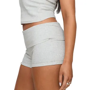 Close-up detail view of grey ribbed yoga fitness shorts with fold-over waistband design.