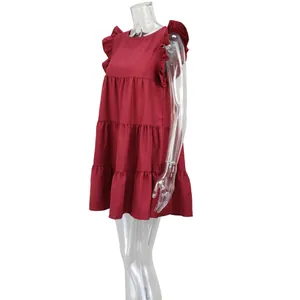 Side view of a red ruffle sleeve tiered mini dress displayed on a clear mannequin