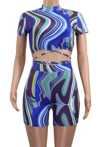 Detailed front view of women's colorful marble print two-piece crop top and shorts set