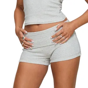 Detail view of grey slim-fit yoga shorts with a stylish turnover waistband design.