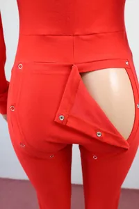 Detail view of red long sleeve pajama romper with functional butt flap snaps