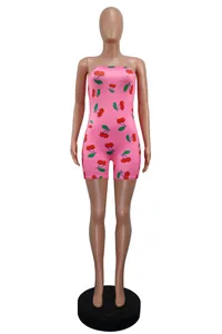 Detail of pink strapless slim-fit romper with all-over cherry print pattern