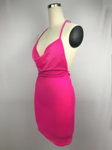 Sexy vibrant pink halter neck backless bodycon mini dress displayed on a mannequin