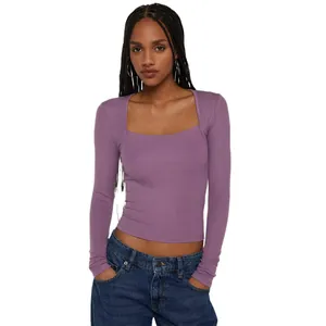 Close-up view of a purple ribbed long-sleeve top featuring a trendy square neckline