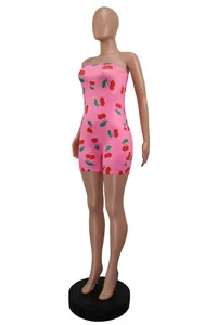 Full-body view of a pink bodycon romper featuring a vibrant red cherry print design
