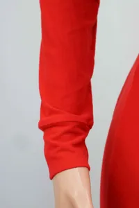 Close-up of the red long-sleeve cuff on a soft knitted pajama jumpsuit for women