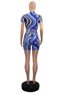 Back view of two-piece shorts set featuring vibrant blue abstract marble swirl print