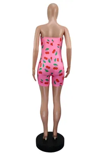 Back view of a sexy pink cherry print strapless slim bodycon jumpsuit displayed on a mannequin