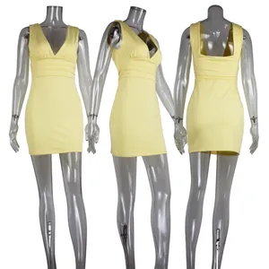 Detailed view of yellow sleeveless deep V-neck bodycon dress with pleated waist design