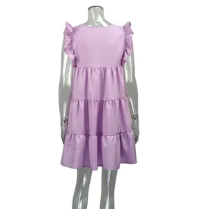 Back view of a summer pink dress with ruffle sleeves and tiered pleated skirt