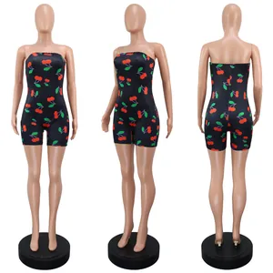 Detail view of a women's strapless cherry print slim romper shown from three angles