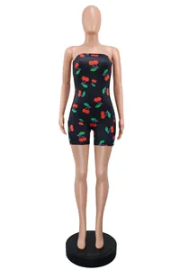Slim-fit strapless black romper jumpsuit featuring a vibrant red cherry pattern detail