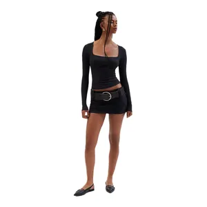 Full body view of a model wearing a slim fit black ribbed long-sleeve square-neck top