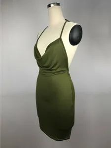 Detailed side view of an olive green cowl neck backless halter mini dress on a mannequin