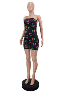 Side view of a sexy strapless black romper with red cherry print on a mannequin.