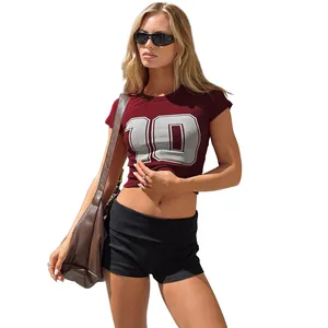 Detail of women's black slim-fit yoga shorts featuring a stylish folded waistband