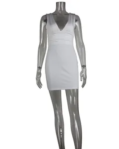 Close-up detail of a white deep V sleeveless bodycon dress with elegant pleated waist detail