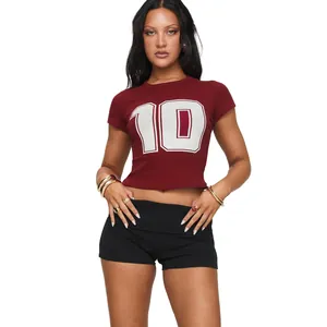 Slim fit black yoga shorts with high waist fold-over design and burgundy crop top