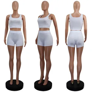 Detailed three-angle view of white two-piece tank top and shorts lounge set