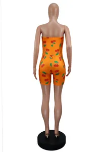 Detailed back view of a sexy orange strapless summer romper with cherry print.