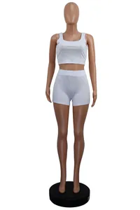 Women's casual white ribbed two-piece lounge set including crop tank top and tight shorts