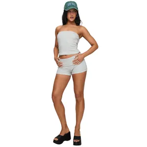 Professional studio shot of a grey two-piece yoga set with tube top and fold-over shorts