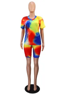 Detailed view of vibrant tie-dye V-neck t-shirt and biker shorts set on mannequin