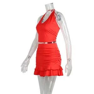 Two-piece red halter neck crop top and ruffled mini skirt set for women's summer fashion.