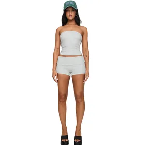 Professional studio shot of a women's grey slim fit tube top and cuffed yoga shorts set
