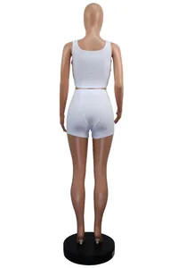 Back view of white ribbed two-piece set featuring tank top and fitted shorts
