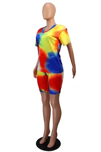 Vibrant tie-dye two-piece set featuring V-neck T-shirt and matching biker shorts for women.