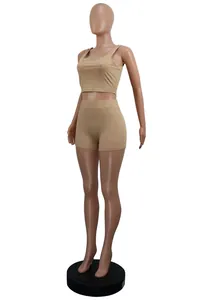 Side view of a tan two-piece ribbed knit crop top and shorts set on a mannequin