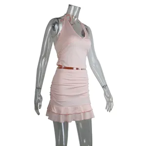 Professional detail shot of pink two-piece set featuring halter top and ruffled skirt