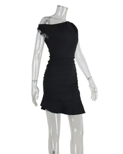 Side view of black bodycon mini dress featuring asymmetric off-shoulder and ruched detail