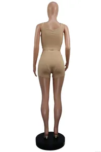 Back view of women's rib-knit two-piece set with crop top and athletic shorts