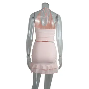 Back view of sexy pink halter top and ruffled mini skirt two-piece set for women