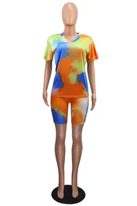 Front view of women's vibrant tie-dye V-neck t-shirt and matching biker shorts set
