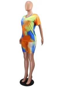 Side view of vibrant tie-dye two-piece set with V-neck top and shorts on a mannequin.