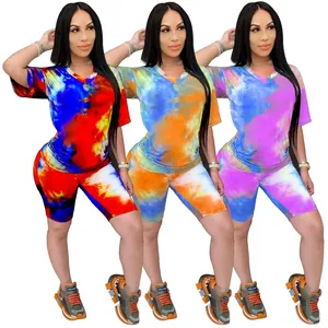 Detailed view of vibrant tie-dye V-neck t-shirt and matching biker shorts set