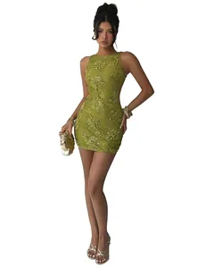 Detailed view of green lace dress with floral embroidery, sequins, and sexy open back