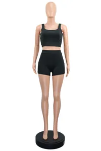 Detailed front view of black two-piece sports set featuring a tank top and shorts