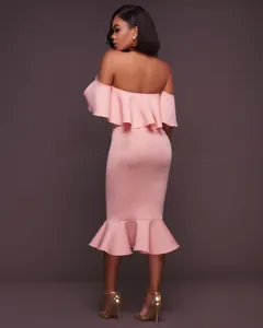 Rear view of pink off-the-shoulder midi dress featuring elegant ruffles and a mermaid hemline