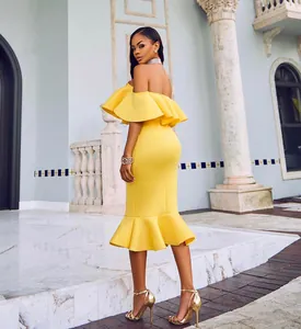 Elegant yellow off-the-shoulder midi dress with ruffle hem and mermaid silhouette